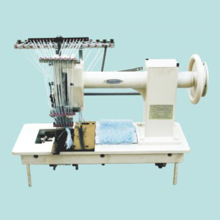 Cutting table tufting machine